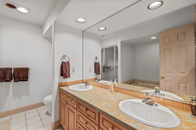 1724 Ski Time Square Dr Unit R5, Steamboat Springs, CO 80487 - full bath with a bath, double vanity, toilet, tile patterned flooring, and recessed lighting