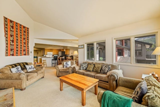 1724 Ski Time Square Dr Unit R5, Steamboat Springs, CO 80487 - living area with light carpet and high vaulted ceiling