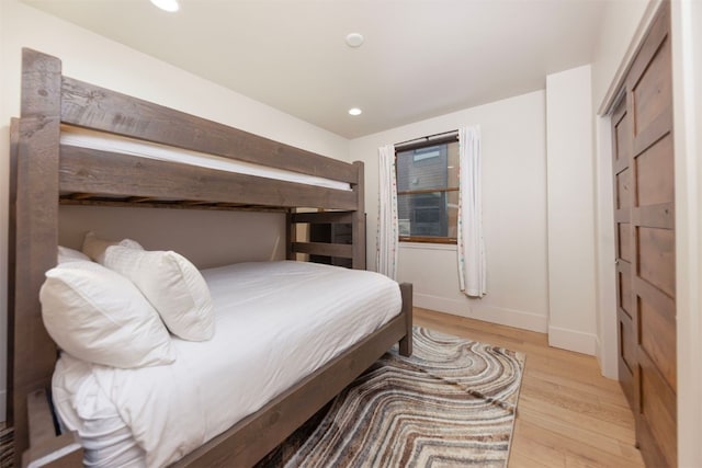1080 Blue River Pkwy Unit 203, Silverthorne, CO 80498 - bedroom featuring baseboards, recessed lighting, and light wood-style floors