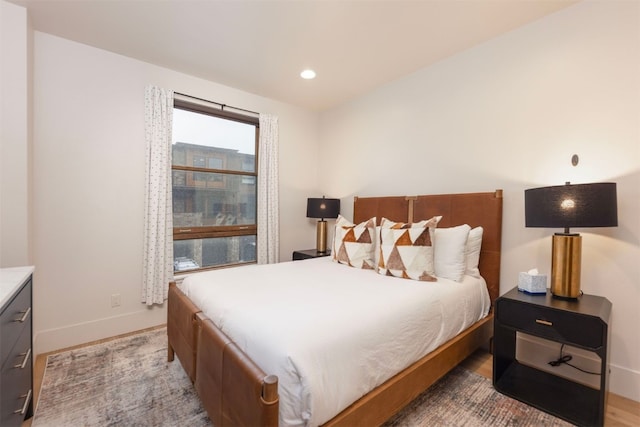 1080 Blue River Pkwy Unit 203, Silverthorne, CO 80498 - bedroom with light wood-type flooring, baseboards, and recessed lighting