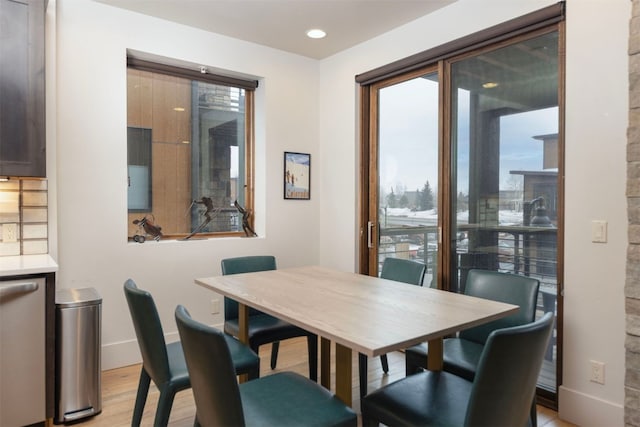 1080 Blue River Pkwy Unit 203, Silverthorne, CO 80498 - dining room with recessed lighting, light wood-type flooring, and baseboards