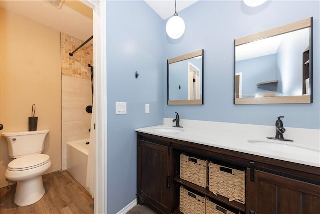 6950 Ryan Gulch Rd Unit 6950, Silverthorne, CO 80498 - bathroom with wood finished floors, double vanity, and toilet