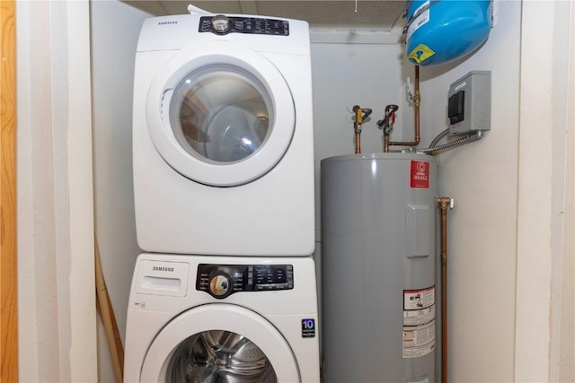 6950 Ryan Gulch Rd Unit 6950, Silverthorne, CO 80498 - clothes washing area featuring water heater and stacked washer and clothes dryer