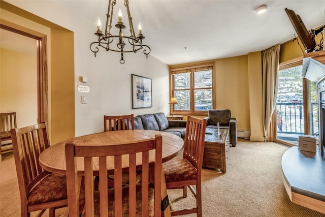 140 Ida Belle Dr Unit 8178, Keystone, CO 80435 - dining space with baseboard heating, light carpet, and an inviting chandelier