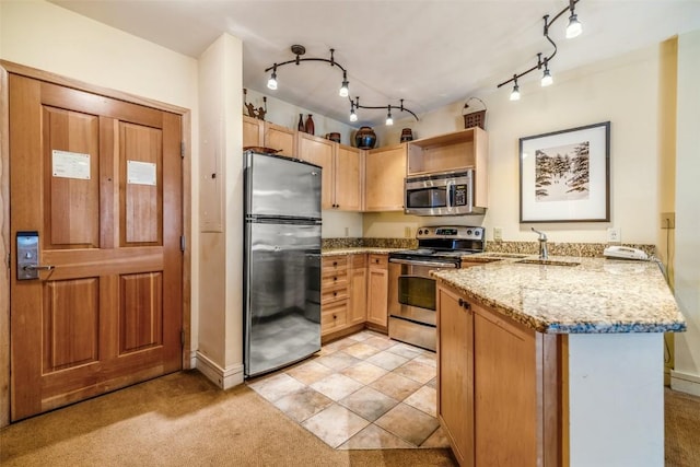 140 Ida Belle Dr Unit 8178, Keystone, CO 80435 - kitchen featuring a peninsula, light stone counters, open shelves, track lighting, and appliances with stainless steel finishes