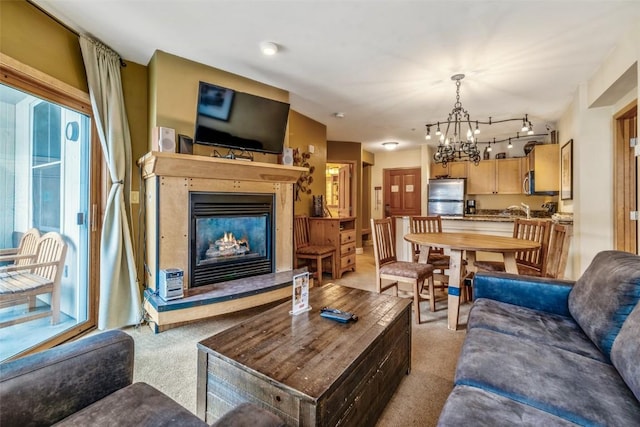 140 Ida Belle Dr Unit 8178, Keystone, CO 80435 - living room featuring light carpet, a notable chandelier, and a glass covered fireplace