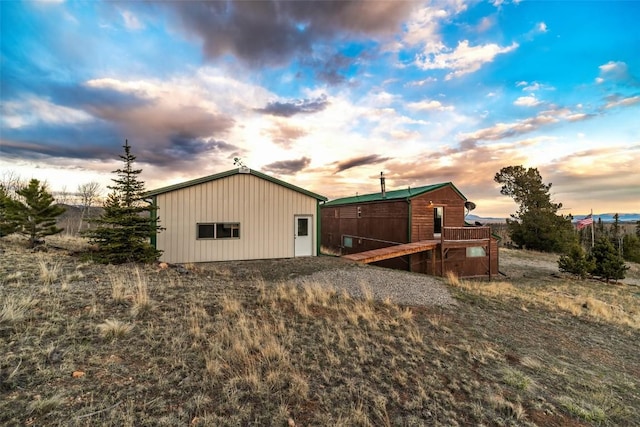 259 Falcon Rd, Como, CO 80432 - back of property at dusk featuring an outdoor structure and an outbuilding