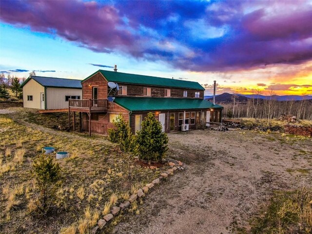 259 Falcon Rd, Como, CO 80432 - view of front of house with metal roof and a deck with mountain view