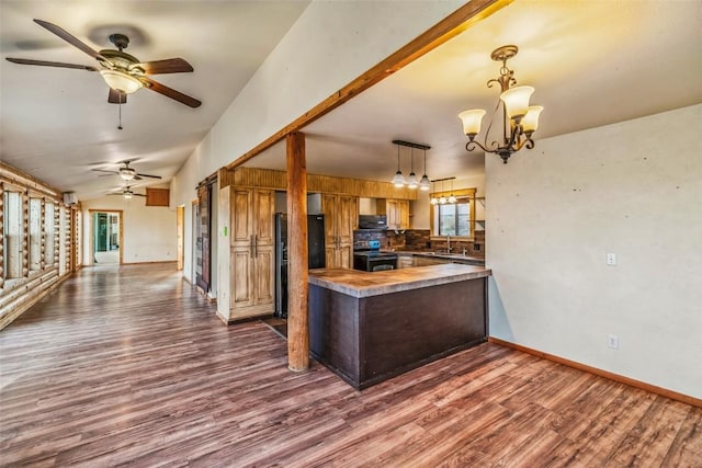 259 Falcon Rd, Como, CO 80432 - kitchen with black appliances, dark wood finished floors, healthy amount of natural light, a ceiling fan, and vaulted ceiling