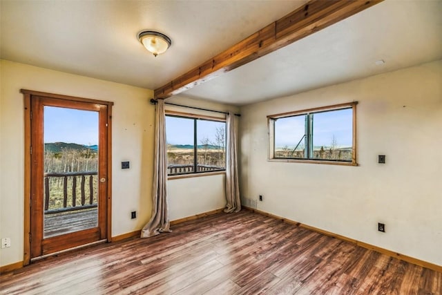 259 Falcon Rd, Como, CO 80432 - spare room with wood finished floors, beam ceiling, and baseboards