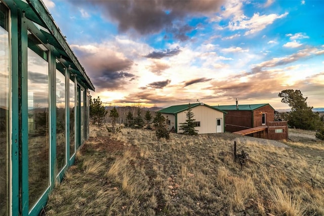 259 Falcon Rd, Como, CO 80432 - yard at dusk featuring an outbuilding and a pole building