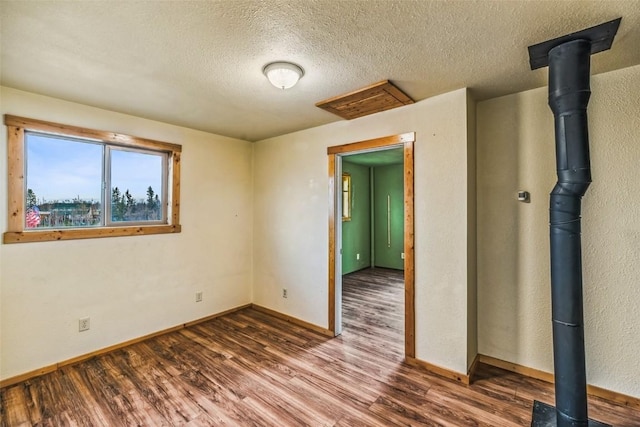 259 Falcon Rd, Como, CO 80432 - unfurnished room featuring dark wood-style flooring, baseboards, and a textured ceiling