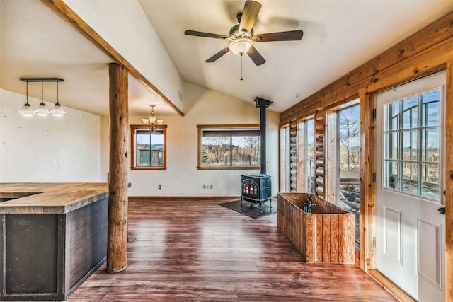 259 Falcon Rd, Como, CO 80432 - living area with a wood stove, wood finished floors, lofted ceiling, ceiling fan, and baseboards