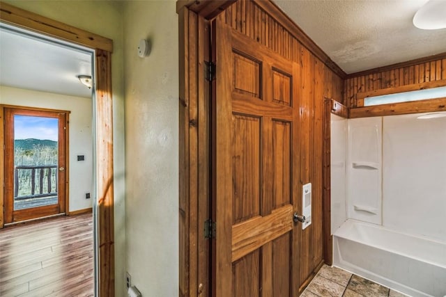 259 Falcon Rd, Como, CO 80432 - bathroom featuring a textured ceiling, tub / shower combination, and baseboards