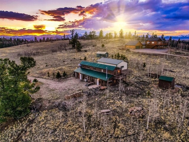 259 Falcon Rd, Como, CO 80432 - yard at dusk featuring a rural view and a deck with mountain view