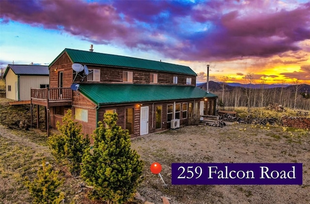 259 Falcon Rd, Como, CO 80432 - back of property at dusk featuring a mountain view and metal roof
