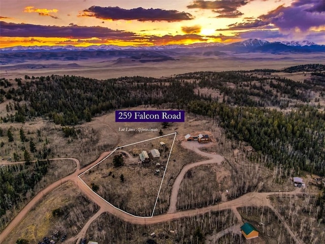 259 Falcon Rd, Como, CO 80432 - aerial view at dusk of a mountain view, a view of trees, and property parcel outlined