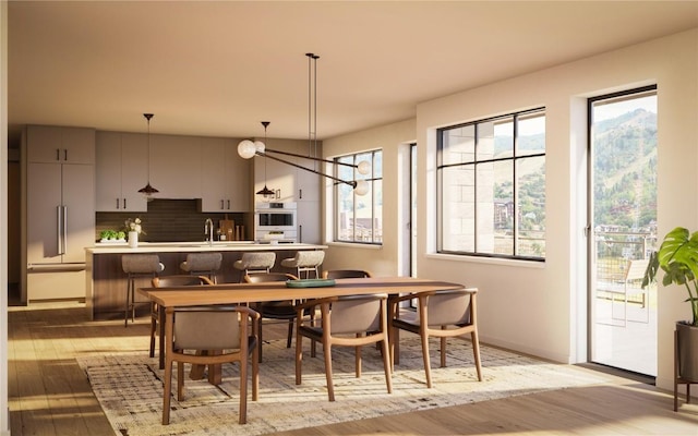 1550 Amble Dr Unit 402, Steamboat Springs, CO 80487 - dining area featuring light wood-style flooring and baseboards