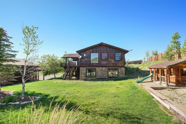 297 County Road 1012, Silverthorne, CO 80498 - back of house with stairway, a playground, a lawn, a wooden deck, and stone siding