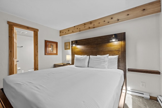 bedroom featuring carpet flooring, baseboard heating, baseboards, ensuite bathroom, and a baseboard heating unit