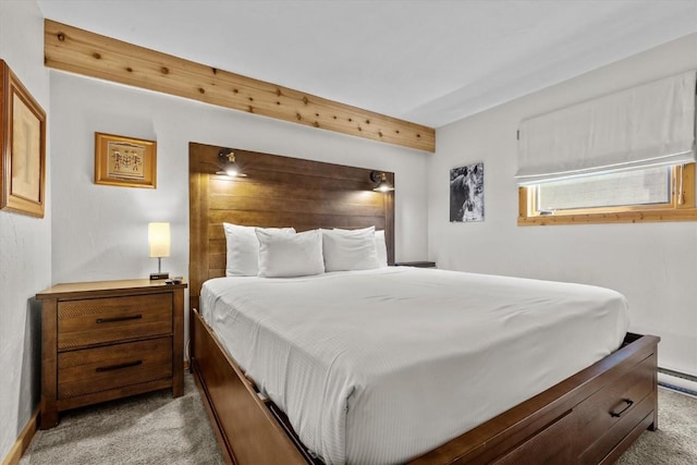 bedroom featuring baseboards and carpet flooring