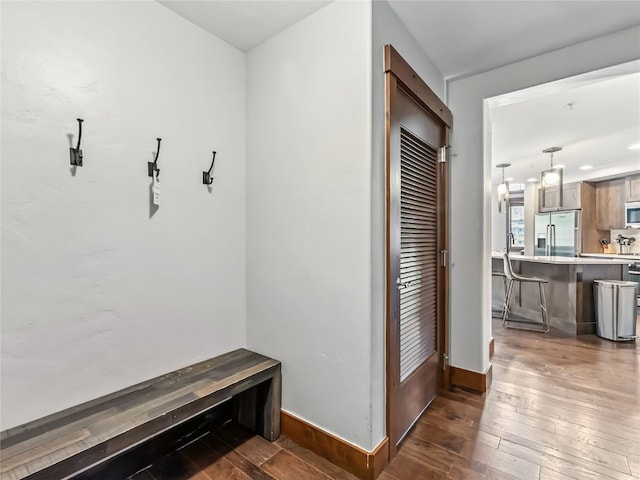 1521 Ski Hill Rd Unit 8424, Breckenridge, CO 80424 - mudroom with baseboards and hardwood / wood-style flooring