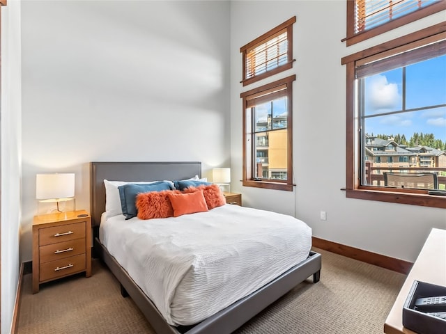 1521 Ski Hill Rd Unit 8424, Breckenridge, CO 80424 - bedroom featuring light colored carpet and a high ceiling