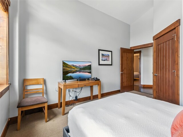 1521 Ski Hill Rd Unit 8424, Breckenridge, CO 80424 - carpeted bedroom with a towering ceiling and baseboards