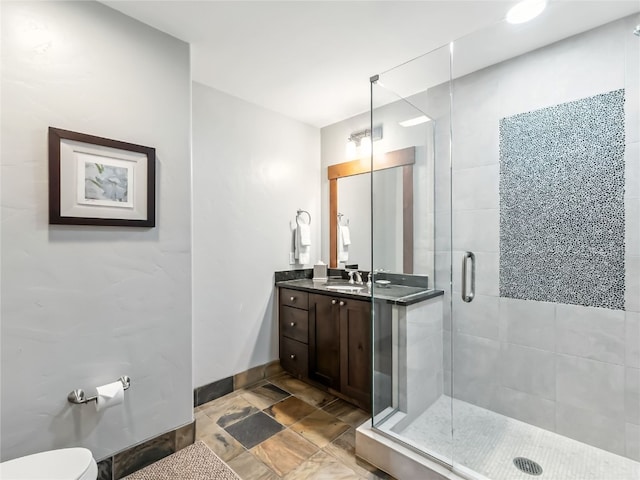 1521 Ski Hill Rd Unit 8424, Breckenridge, CO 80424 - bathroom featuring vanity, a shower stall, and stone finish flooring
