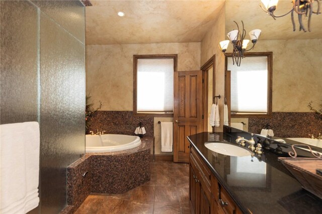 60 Trafalgar Dr, Breckenridge, CO 80424 - full bath featuring a bath, a wealth of natural light, vanity, and a chandelier