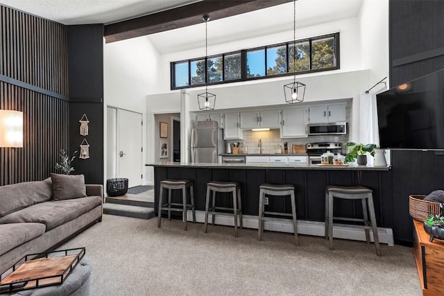 1127 Ski Hill Rd Unit 106, Breckenridge, CO 80424 - living room with high vaulted ceiling, carpet, and beamed ceiling