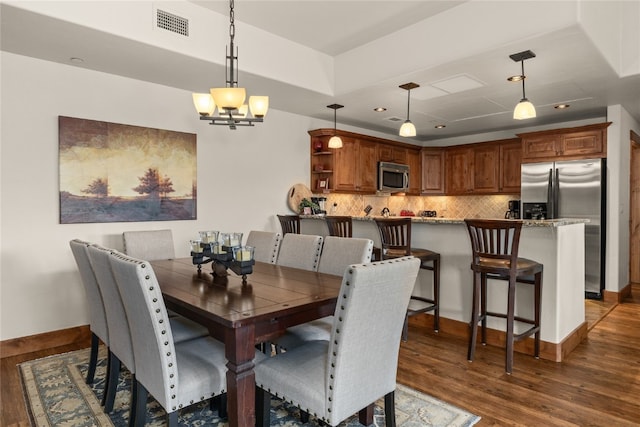 1800 Medicine Springs Dr Unit 5303, Steamboat Springs, CO 80487 - dining area featuring dark wood-style flooring, a chandelier, and recessed lighting