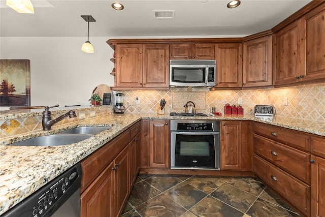 1800 Medicine Springs Dr Unit 5303, Steamboat Springs, CO 80487 - kitchen featuring stainless steel appliances, recessed lighting, backsplash, light stone counters, and decorative light fixtures