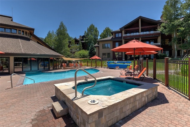 1800 Medicine Springs Dr Unit 5303, Steamboat Springs, CO 80487 - community pool with a community hot tub and a patio area
