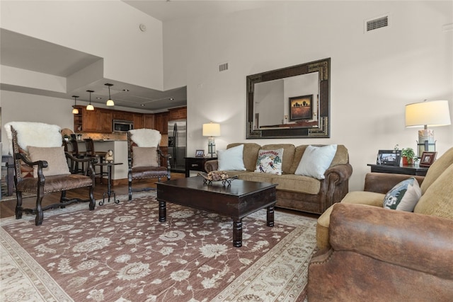 1800 Medicine Springs Dr Unit 5303, Steamboat Springs, CO 80487 - living area with a high ceiling and light wood-type flooring