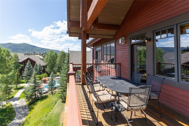 1800 Medicine Springs Dr Unit 5303, Steamboat Springs, CO 80487 - wooden deck with a mountain view and outdoor dining space