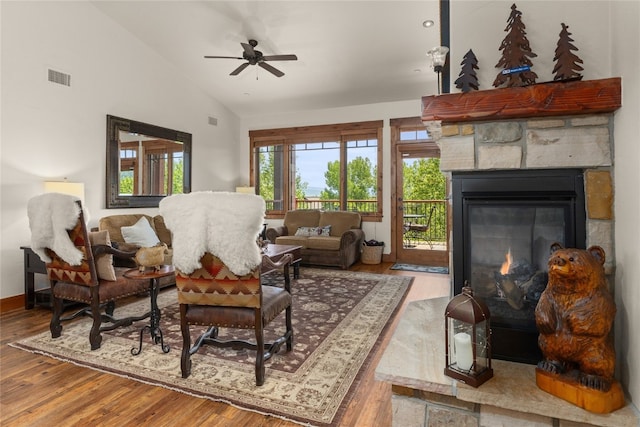 1800 Medicine Springs Dr Unit 5303, Steamboat Springs, CO 80487 - living area with vaulted ceiling, ceiling fan, wood finished floors, and a stone fireplace