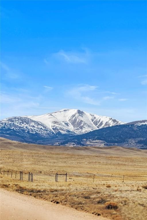 mountain view featuring a rural view