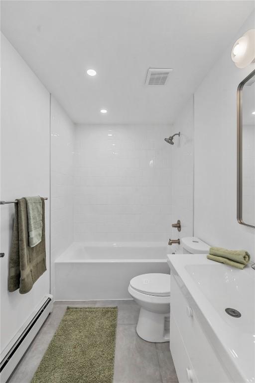full bath featuring baseboard heating, vanity,  shower combination, toilet, and visible vents