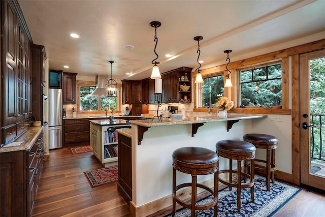 2415 Val Disere Cir, Steamboat Springs, CO 80487 - kitchen featuring open shelves, dark wood-type flooring, ventilation hood, dark brown cabinets, and recessed lighting