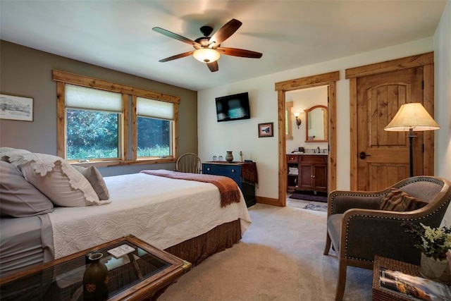 2415 Val Disere Cir, Steamboat Springs, CO 80487 - bedroom with light carpet, ensuite bathroom, and ceiling fan