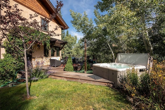 2415 Val Disere Cir, Steamboat Springs, CO 80487 - view of grassy yard with a hot tub and a wooden deck