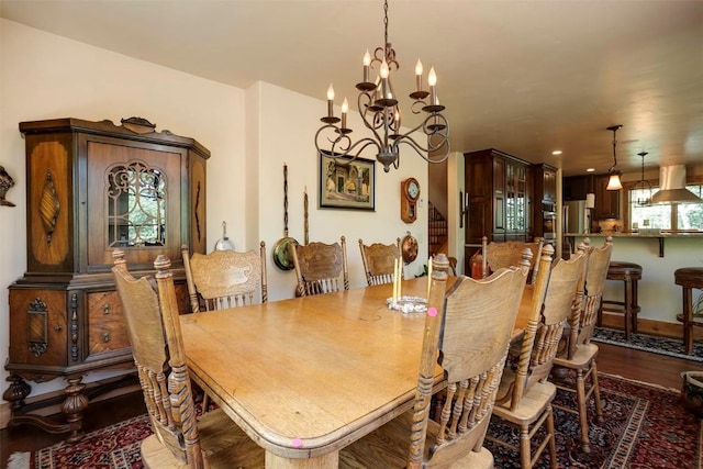 2415 Val Disere Cir, Steamboat Springs, CO 80487 - dining area with a chandelier and dark wood-style floors