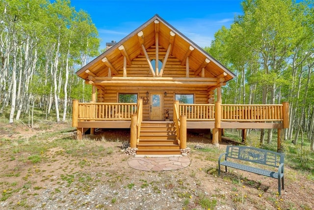 633 French Pass Cir, Jefferson, CO 80456 - log-style house featuring log exterior, a chimney, and a deck