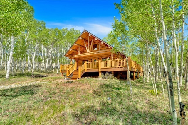 633 French Pass Cir, Jefferson, CO 80456 - rear view of house with log exterior and a wooden deck