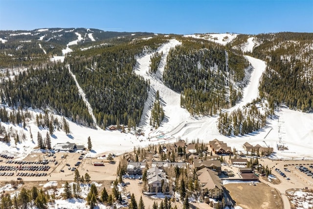 1203 W Keystone Rd Unit 2709, Keystone, CO 80435 - snowy aerial view featuring a view of trees and a mountain view