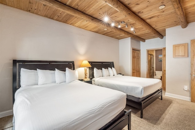 1203 W Keystone Rd Unit 2709, Keystone, CO 80435 - carpeted bedroom featuring wood ceiling, ensuite bathroom, baseboards, and beamed ceiling