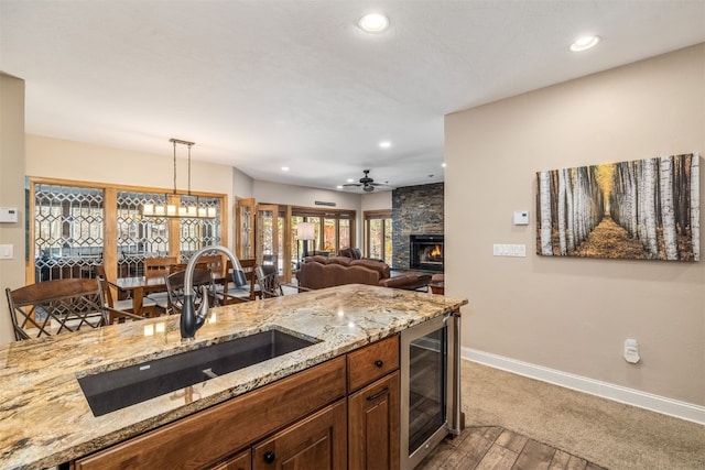 1203 W Keystone Rd Unit 2709, Keystone, CO 80435 - kitchen featuring wine cooler, a sink, baseboards, recessed lighting, and wood finished floors