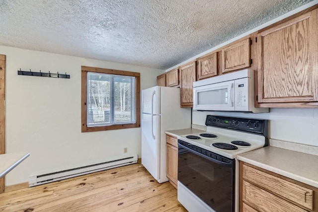 kitchen featuring a baseboard radiator, a textured ceiling, light wood-style flooring, white appliances, and light countertops