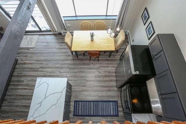 9876 Ryan Gulch Rd Unit F303, Silverthorne, CO 80498 - interior space featuring baseboard heating and wood finished floors